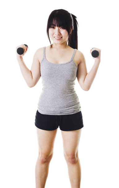Chinese woman holding two hand weights. - Foto, Bild