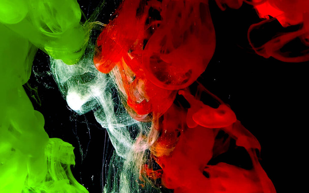 Green, white and red watercolor ink in water.  - Foto, Bild