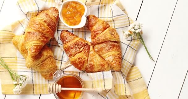 Croissants and condiments composition on the table - Footage, Video