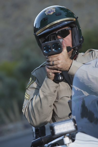 Policeman sits on motorcycle - Foto, Imagen