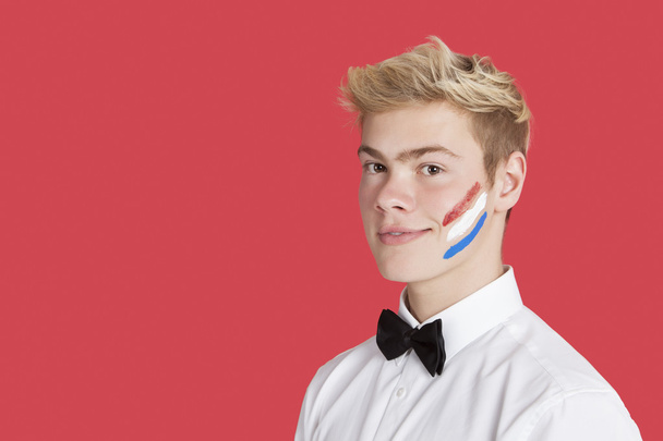 Man with Dutch flag on face - Foto, imagen