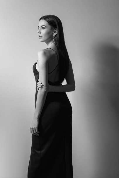 Black and white portrait of beautiful fashionable young woman - 写真・画像