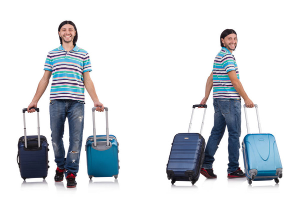 Joven viajando con maletas aisladas en blanco - Foto, Imagen