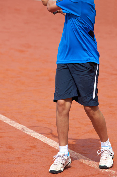 young tennis player hits theball - Фото, изображение