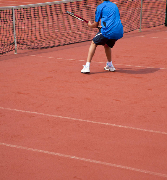 young tennis player hits theball - Fotoğraf, Görsel