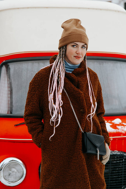 Outdoor portrait of young beautiful fashionable happy smiling girl wearing trendy faux fur winter coat - Fotoğraf, Görsel