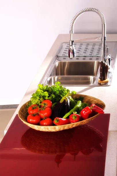 close up shot of vegetables basket in domestic kitchen. - Foto, Imagen