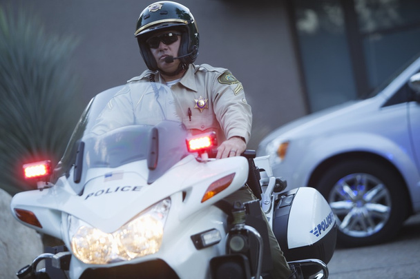 Patrol officer sits on motorcycle - Zdjęcie, obraz