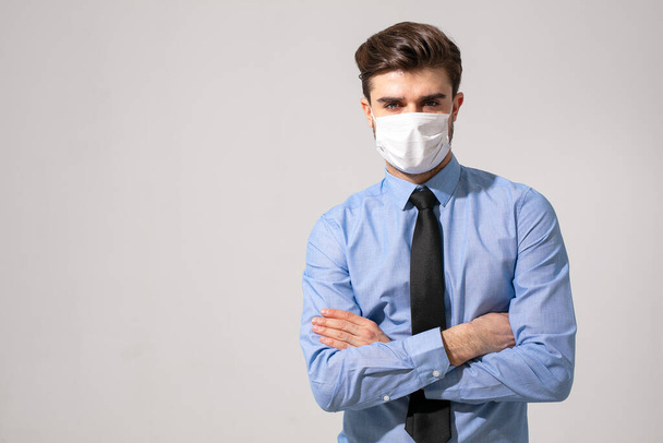is time to protect all the time. elegant man wearing a mouth protection to prevent getting sick at work or on the way to work - 写真・画像
