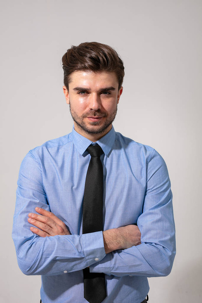 handsome and young man, wearing a formal outfit for going to work - Foto, afbeelding