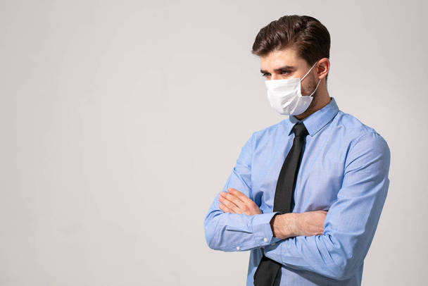 is time to protect all the time. elegant man wearing a mouth protection to prevent getting sick at work or on the way to work - 写真・画像