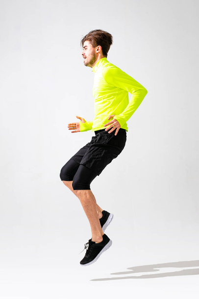 young normal person doing exercise and running, studio shoot isolated on white - Foto, afbeelding