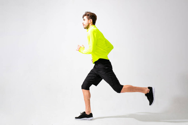young normal person doing exercise and running, studio shoot isolated on white - Fotoğraf, Görsel