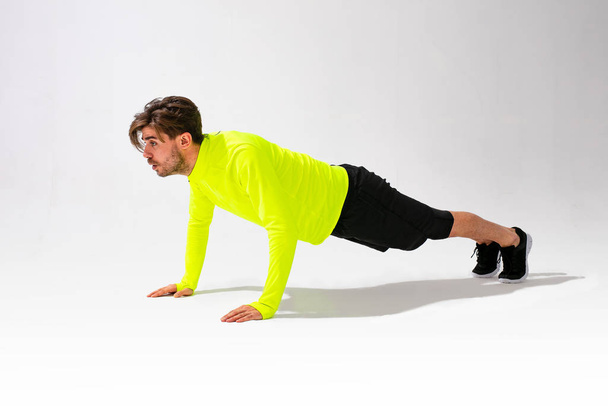 young normal person doing different kind of pushups, train and stay fit - Photo, Image