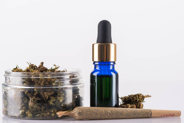 Cannabidiol Oil and Cannabis Flower Buds. Medical Marijuana Conc - Фото, изображение