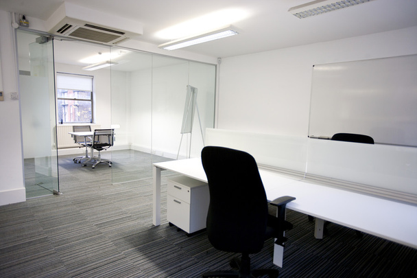 Office desk with meeting room - Foto, afbeelding