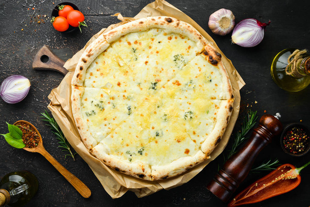 Homemade cheese pizza. Italian traditional cuisine. Top view. free space for your text. - 写真・画像