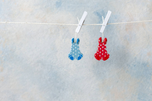Easter decoration   bunny figurines hang on a lace  - Photo, Image