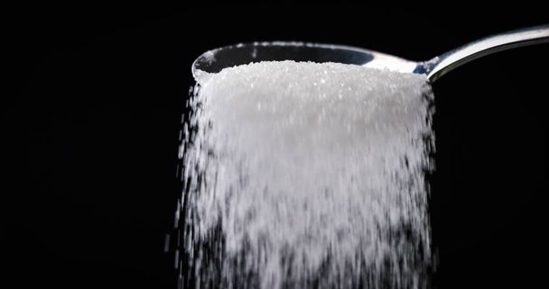Sugar or Salt falling off spoon - Foto, Imagem