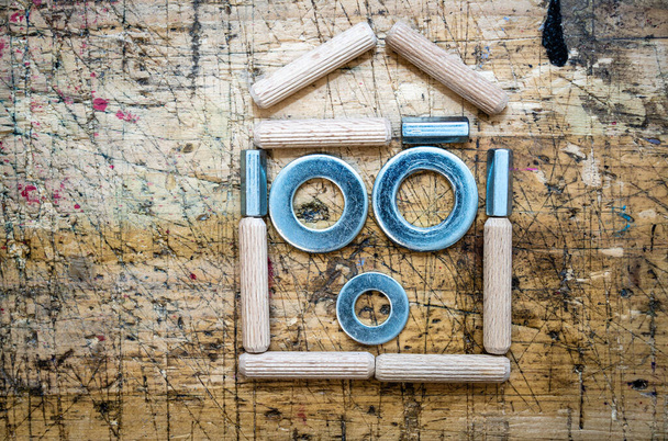 Home shape made with assorted hardware items, nuts, washers and  - Photo, Image