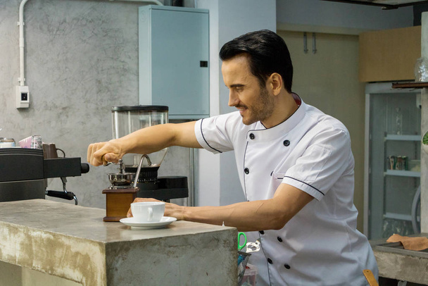 Barista is making coffee in a coffee shop. - Фото, зображення