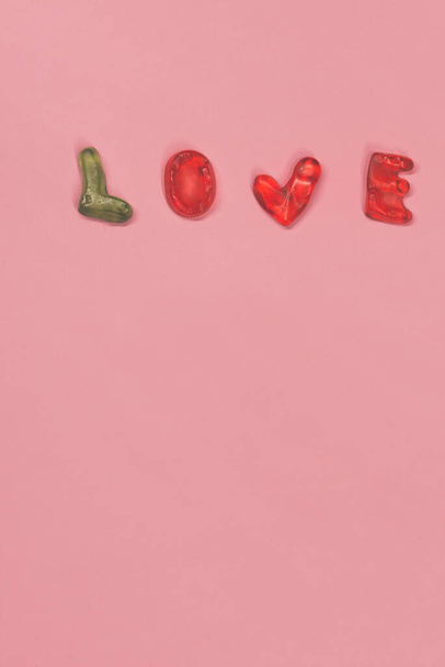 Love text from candies. Pink retro toned. - Photo, Image