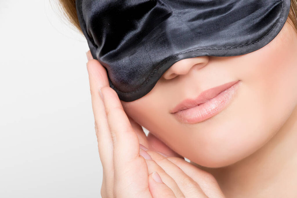 Gorgeous woman with black sleep mask - Fotografie, Obrázek
