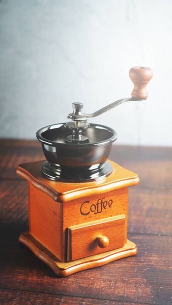 Wooden manual coffee grinder, still life. - Photo, image