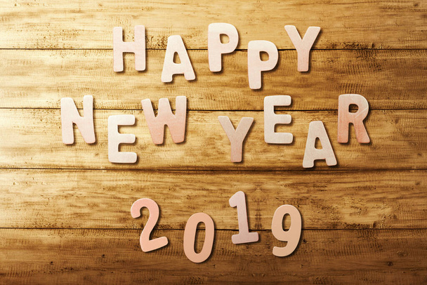 Happy New Year 2019 text on wooden table. Happy New Year 2019 - Zdjęcie, obraz