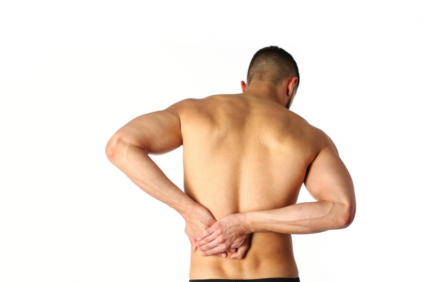 Young man holding his neck in pain. Medical concept - Photo, image