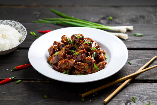 Delicious General Tso's Chicken dish angled view. - Fotoğraf, Görsel