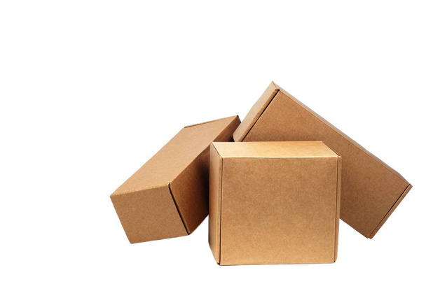 Cardboard boxes for goods on a white background. Different size. Isolated on white background - Foto, Bild