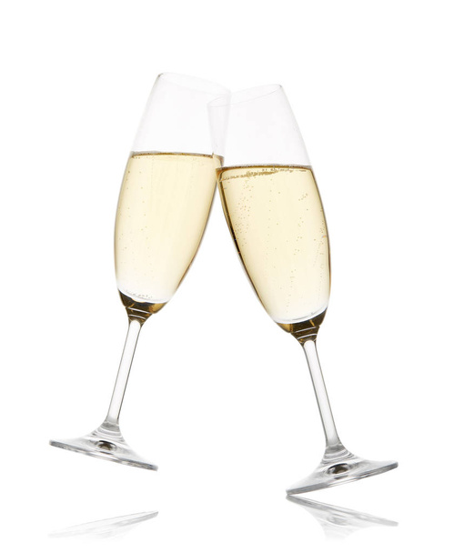Two wineglasses with champagne isolated on a white background with reflection - Photo, image