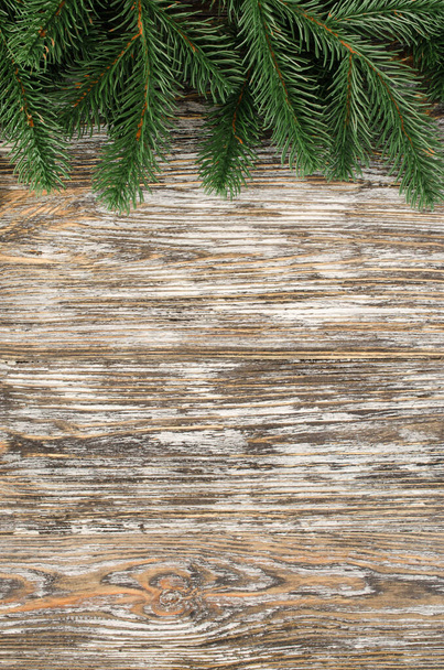 Christmas and New Year wooden background with fir tree in rustic style. Christmas card. View with copy space. - Foto, Imagen