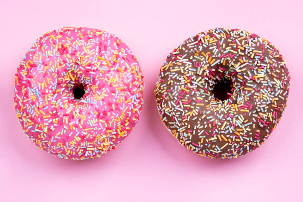 Two delicious Donut on pink Backgrount - Foto, imagen