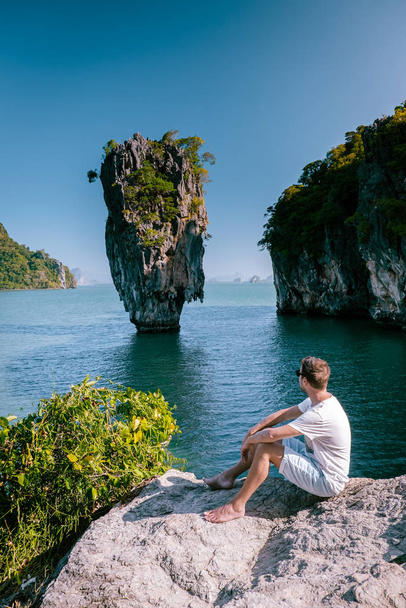young men on vacation in Thailand visiting the bay of Phannga famous for its James Bond Island and viewpoints over the Islands and bay - Fotoğraf, Görsel