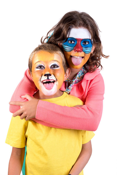 Children's couple with animal face-paint isolated in white - Valokuva, kuva