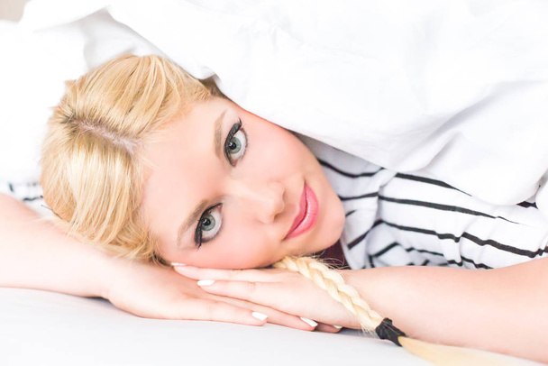 Beautiful blonde woman in the bed - Фото, зображення