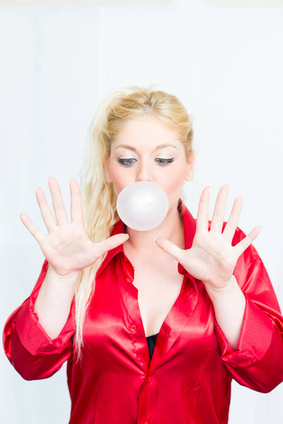 Blonde woman chews gum - Photo, Image