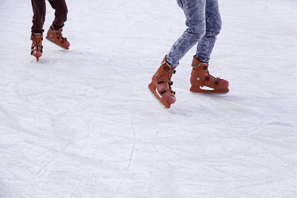People ice skating, winter sports details - Fotoğraf, Görsel
