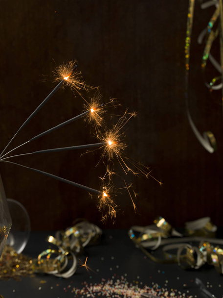 new year background with star splatter and sparkler and many different new year items - Φωτογραφία, εικόνα