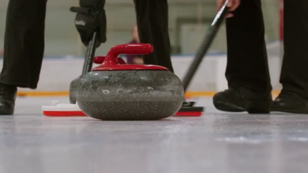 Curling training - a granite stone biter with red handle hitting another biter of opposite team - Footage, Video