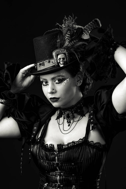 Emotional Portrait of Young Woman in Steampunk or Retro style. Studio shot. Model on a Black Background - Foto, immagini