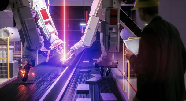 Smart automation industry robot in action welding metall while engineer uses his remote control table pc- industry 4.0 concept - 3D rendering - Foto, afbeelding
