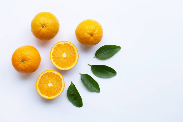 Fresh orange citrus fruit with leaves isolated on white wooden background.  Top view - Zdjęcie, obraz