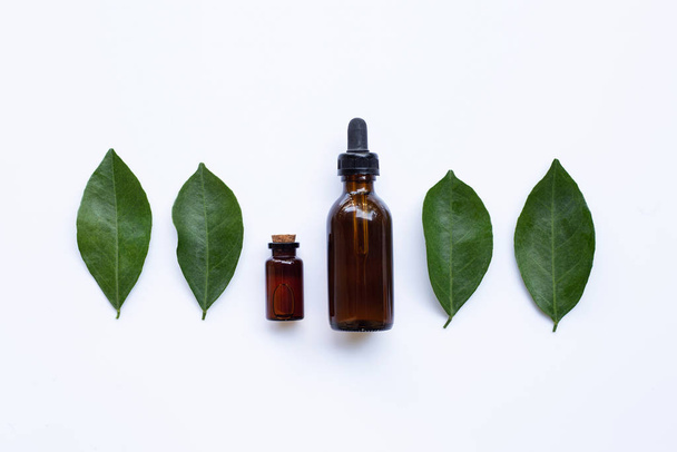 Essential oil with orange leaves - Фото, изображение