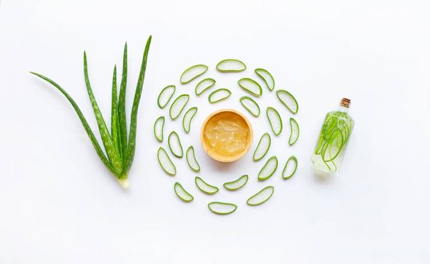 Aloe vera with slices and extract on white background. - Foto, Imagen