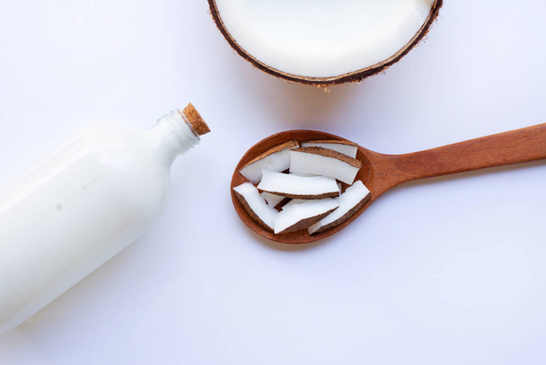 Coconut and coconut milk on white background. - Foto, Imagen