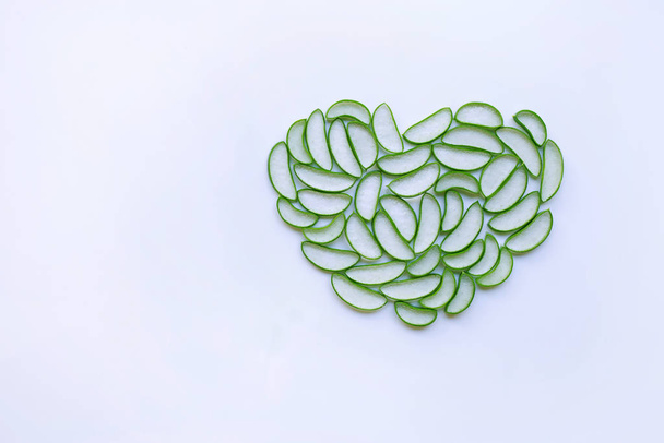 aloe vera slices heart shaped on white background. Copy space - Foto, Imagen