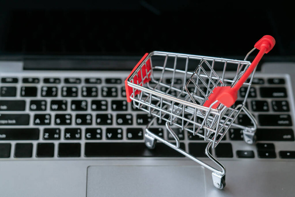shopping cart on laptop, online shopping concept - Photo, Image